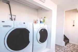 a white washer and dryer in a room at Yellowknife Downtown 50a avenue Retreat in Yellowknife