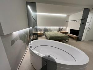 a bathroom with a bath tub in a room at Seacity Suite & Stay in Monopoli