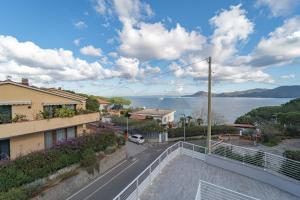 a view of the water from the balcony of a house at Residence Padulella - Goelba in Portoferraio