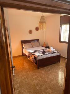 Ein Bett oder Betten in einem Zimmer der Unterkunft ASNFU AUBERGe