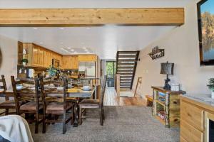 a dining room and kitchen with a table and chairs at Lakefront at the Village in Big Bear Lake