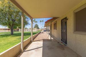 an empty hallway of a building with a sidewalk at New remodeled home on golf course in Mesa