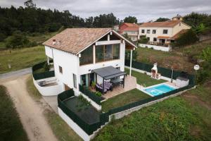 an overhead view of a house with a swimming pool at La Casa del Camino in Santiago de Compostela