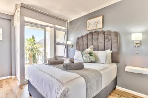 Ein Bett oder Betten in einem Zimmer der Unterkunft Beautiful studio in convenient Green Point