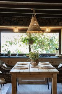 a wooden table with plants on it in a kitchen at La Finquita in Tías