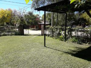 a gazebo sitting in the middle of a yard at Departamentos Don Carlos in Villa Cura Brochero
