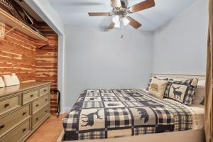 a bedroom with a bed and a ceiling fan at Alpine Alcove: Tahoe Tranquility Near Kings Beach in Tahoe Vista