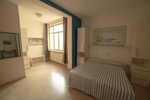 Postel nebo postele na pokoji v ubytování Hotel Corallo