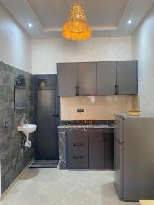 a kitchen with a sink and a counter top at WOW beach house in Imsouane