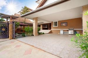 an image of a house with a patio at Phuket Private Pool and Thai Villa Style by Andaman Home in Phuket Town
