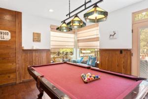 a pool table in a living room with a ping pong ball at Knoll Lake Cabin in Big Bear Lake in Big Bear Lake
