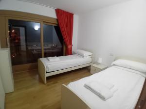 A bed or beds in a room at Residence Rose