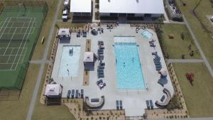 an overhead view of two swimming pools on a tennis court at CreekFire RV Resort in Savannah