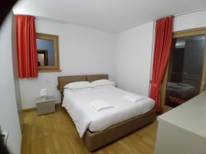 A bed or beds in a room at Residence Rose