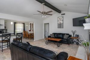 a living room with a couch and a table at Eclectic Country Home in Leander