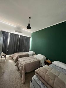 Ένα ή περισσότερα κρεβάτια σε δωμάτιο στο Don Enrique Bar&Hostel