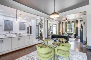 a kitchen and living room with a glass table and chairs at Stylish Home in Springfield Historic District! in Jacksonville