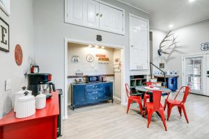 a kitchen with a red table and chairs and a kitchen with a blue cabinet at Cherry Tree Studio Arizona Retreat Near Route 66 in Williams +24 photos