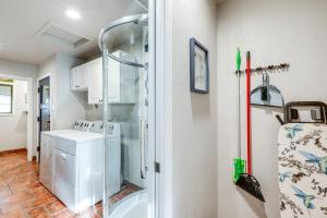 a bathroom with a shower and a washer and dryer at Cherry Tree Studio Williams Retreat Near Rte 66! in Williams