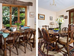 a kitchen and dining room with a wooden table and chairs at 3 Bed in Hay-on-Wye BN345 in Hay-on-Wye