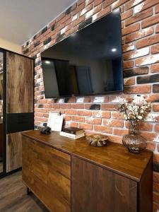 TV a/nebo společenská místnost v ubytování Top Location Apartment + 37 fotografií
