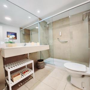 a bathroom with a sink and a toilet and a shower at Luxury Apartment Playa del Inglés in San Bartolomé de Tirajana