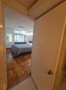 a bedroom with a bed in a room at Las condes, Amplia habitación con baño privado in Santiago