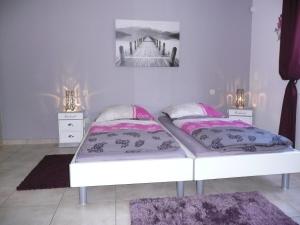 Postel nebo postele na pokoji v ubytování Ferienwohnung "Sweet Home"