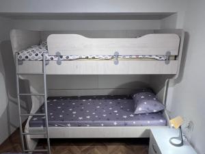two bunk beds in a room with a pillow at Mavrovo Square One Bedroom APARTMENT in Mavrovo
