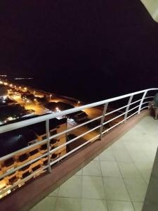 a railing on top of a building at night at Atacames Hermosa Vista y Comodidad in Atacames