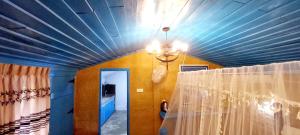 a room with a blue ceiling with a curtain at Selnara Private Luxury Villa and Ayurveda Spa in Bentota +37 photos