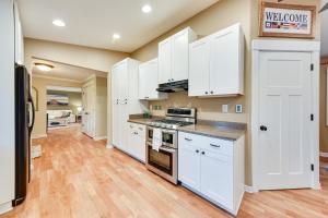 a kitchen with white cabinets and a counter top at Family-Friendly Twin Lakes Home Near Lake Mary! in Twin Lakes