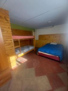 a room with two bunk beds in it at Dos Soles in El Bolsón