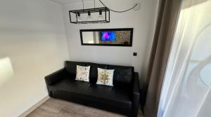 TV a/nebo společenská místnost v ubytování A ESTRENAR PRECIOSOS APARTAMENTOS APARTHOTEL INTER2, NEW APARTMENTS lN APARTHOTEL 12 months open! self check in! RESERVA Garaje!
