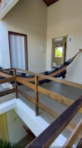 a hammock in the middle of a room at Pousada Esmeralda in Maragogi
