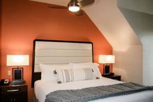 a bedroom with a large bed with two lamps at Hyatt Residence Club Main Street Station in Breckenridge +19 photos