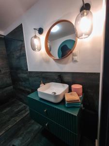 a bathroom with a sink and a mirror at TOTie in Grudziądz