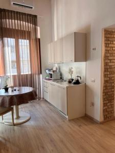 Kuchyň nebo kuchyňský kout v ubytování Affittacamere Louis