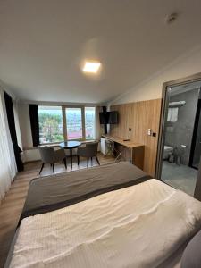 A bed or beds in a room at Pendik Marine Hotel