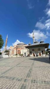 a large building with two towers on top of it at Cozy Stay with a Turkish bath,in heart of AyaSofia in Istanbul