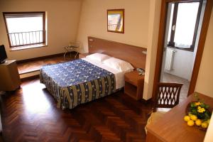 Postel nebo postele na pokoji v ubytování Hotel Del Sole