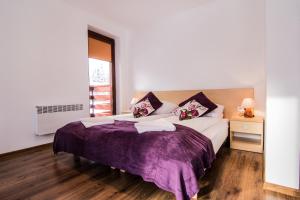 Posteľ alebo postele v izbe v ubytovaní Dolina Resort Zakopane