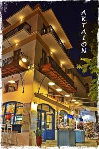 a building with two balconies on top of it at Aktaion Guest Rooms in Skopelos Town