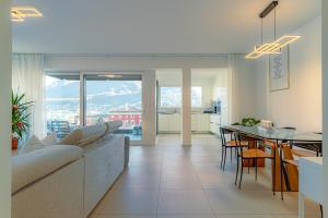 a living room with a couch and a table at IMPERIAL of LUGANO apartment-behind the station with FREE parking in Lugano