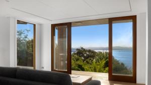 a living room with a view of the ocean at Sunset Haven in Nelson in Nelson