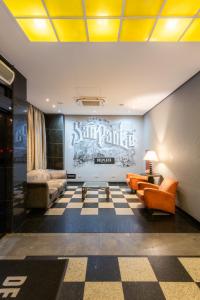 A seating area at DELPLAZA Excelsior São Paulo - By Monreale