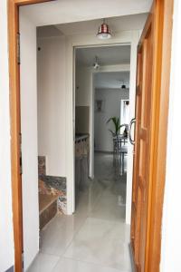a hallway leading to the kitchen and dining room in a house at Casa Vacanze La Dimora di Santa Barbara in Petralia Soprana