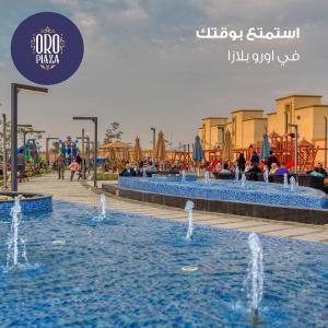 un grupo de fuentes de agua en un parque acuático en فندق أورو بلازا ORO Plaza Hotel, en El Cairo