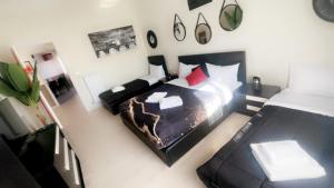 an overhead view of a bedroom with two beds at Vatican Sofia house in Rome