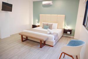Ein Bett oder Betten in einem Zimmer der Unterkunft Mare Playa del Carmen
